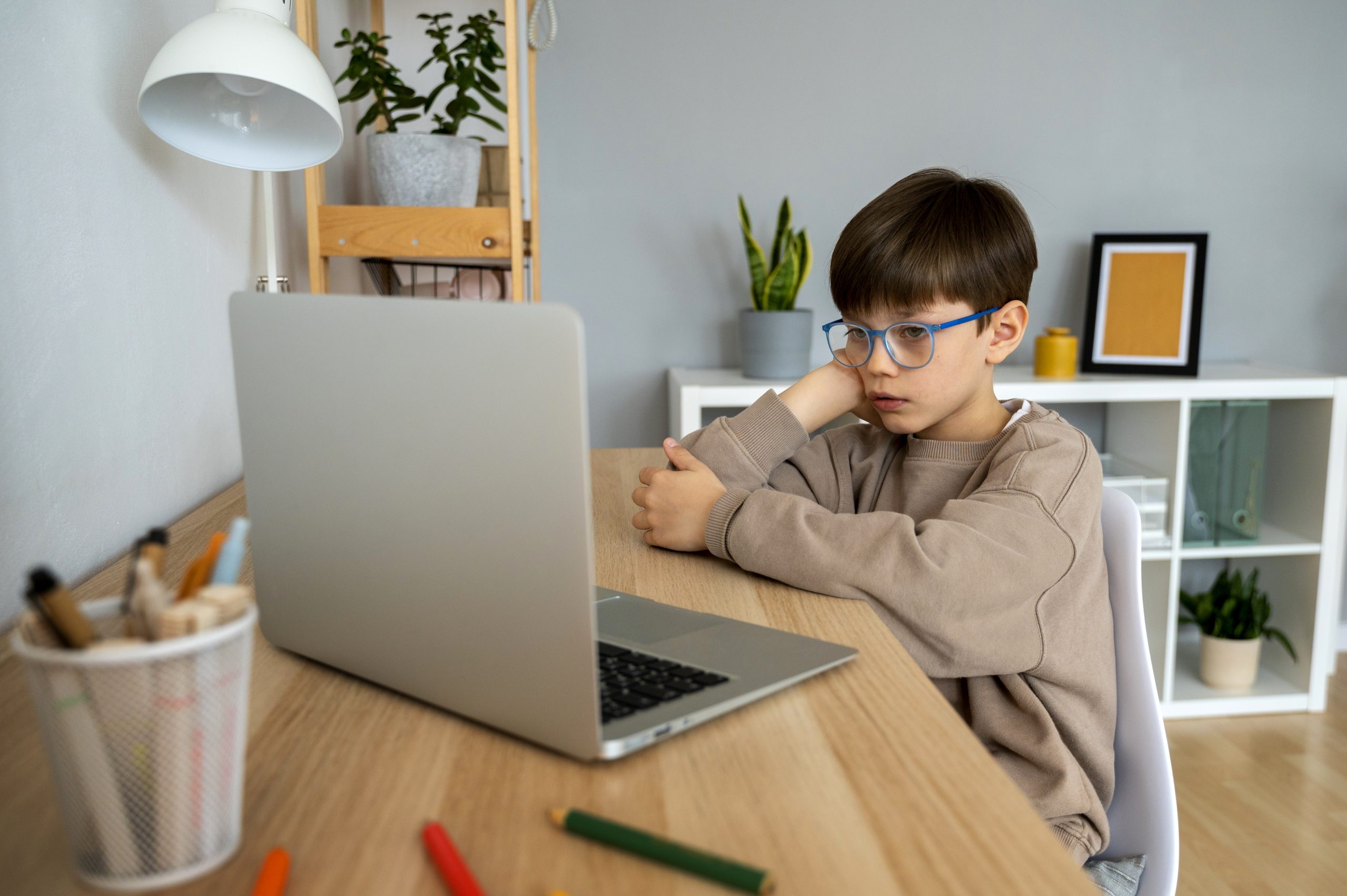 little-boy-watching-films-laptop