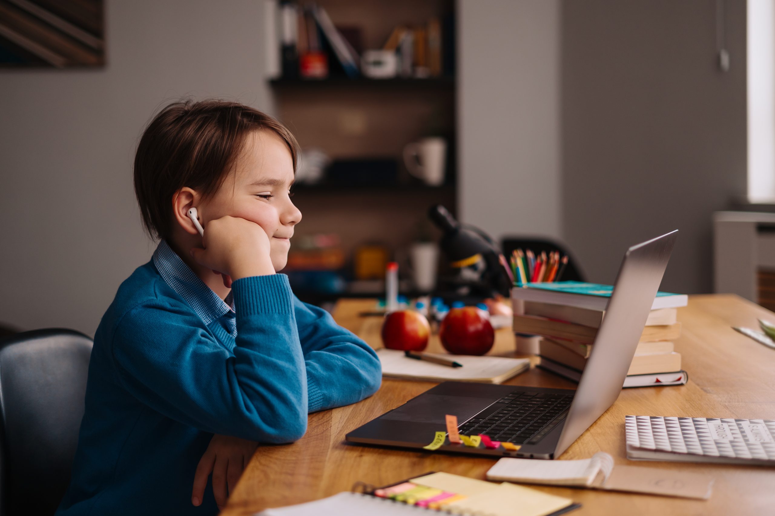Online learning, boy using laptop for his classes